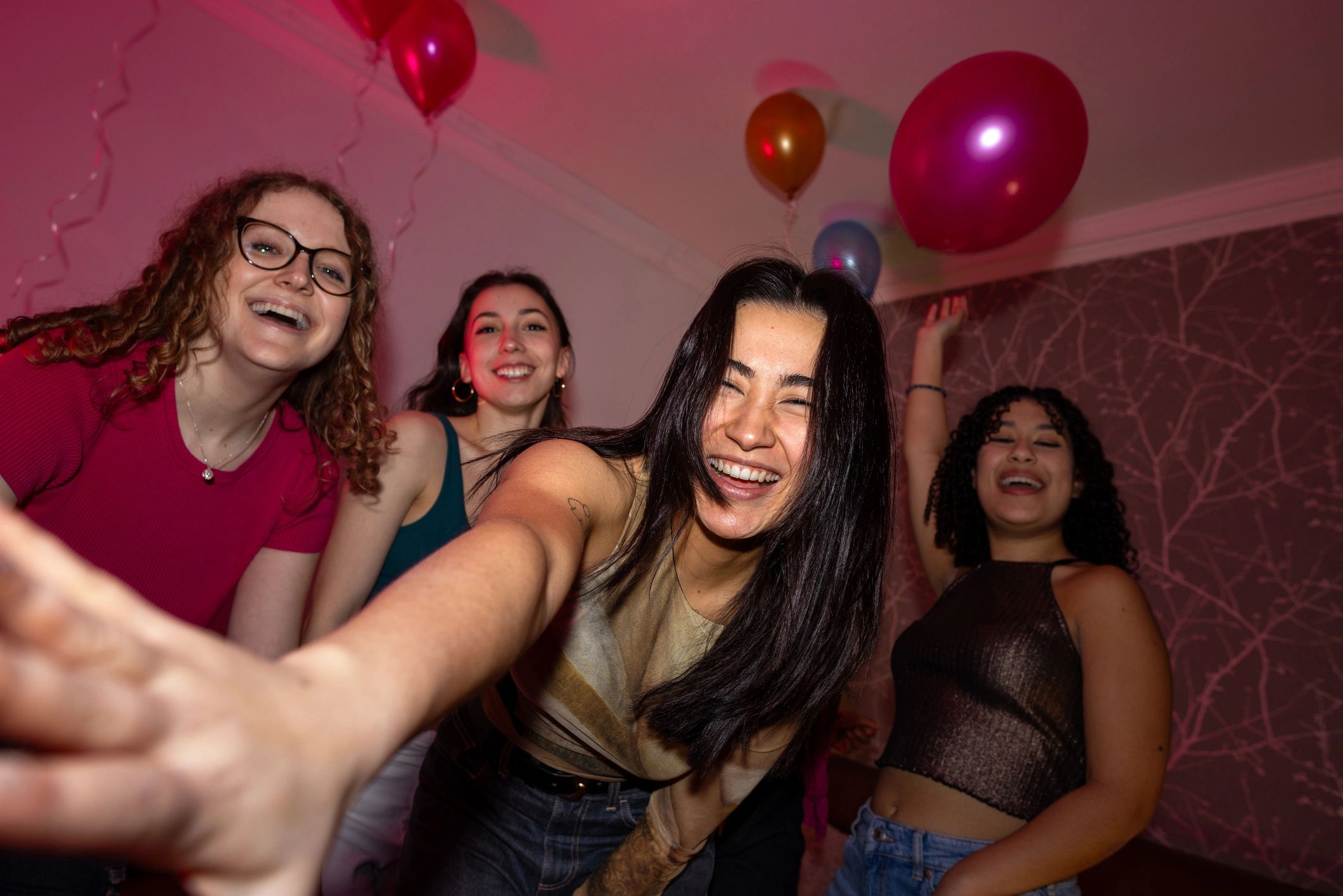 Group of friends dancing and celebrating at a party